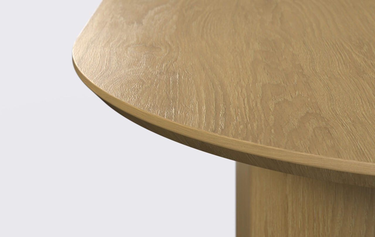 stół owalny fornirowany na jednej nodze, krawędź blatu podcięta od dołu.